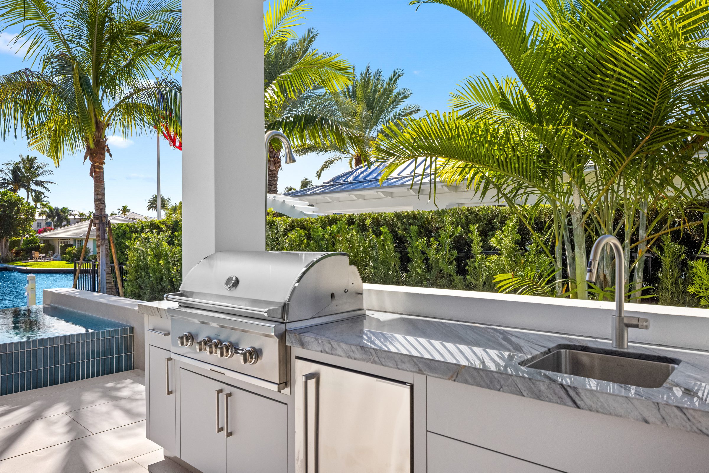 Outdoor kitchen and grill area in Delray Beach — built by Varga Homes