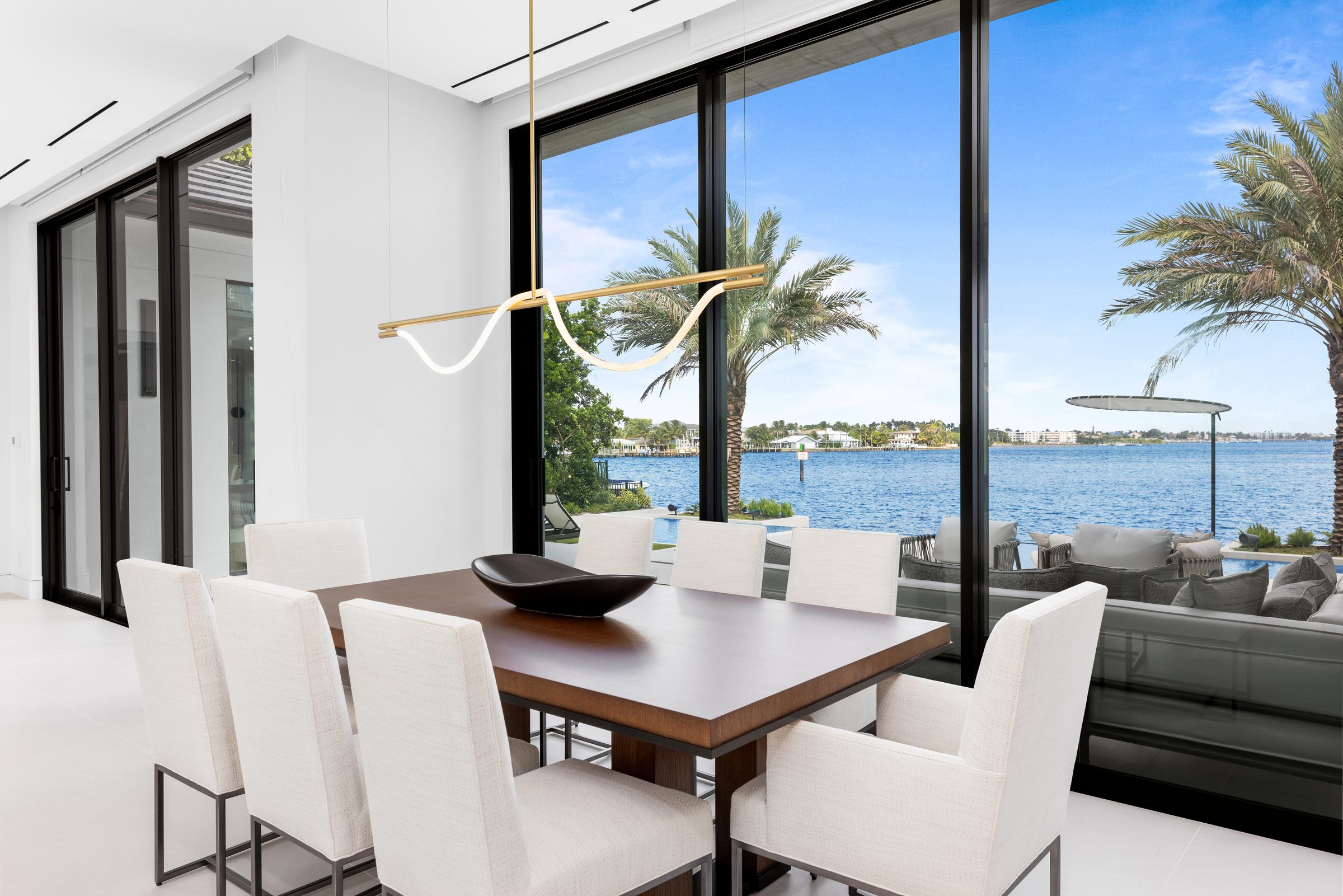 Dining room with water views in Ocean Ridge — built by Varga Homes