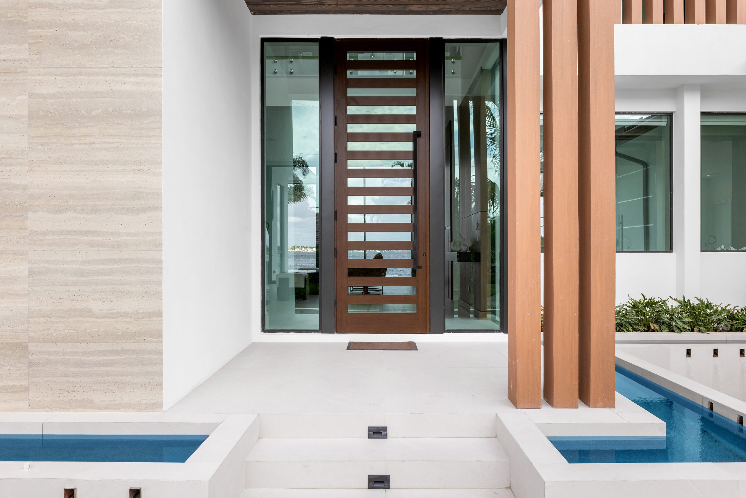 Front elevation of the custom home in Ocean Ridge — built by Varga Homes