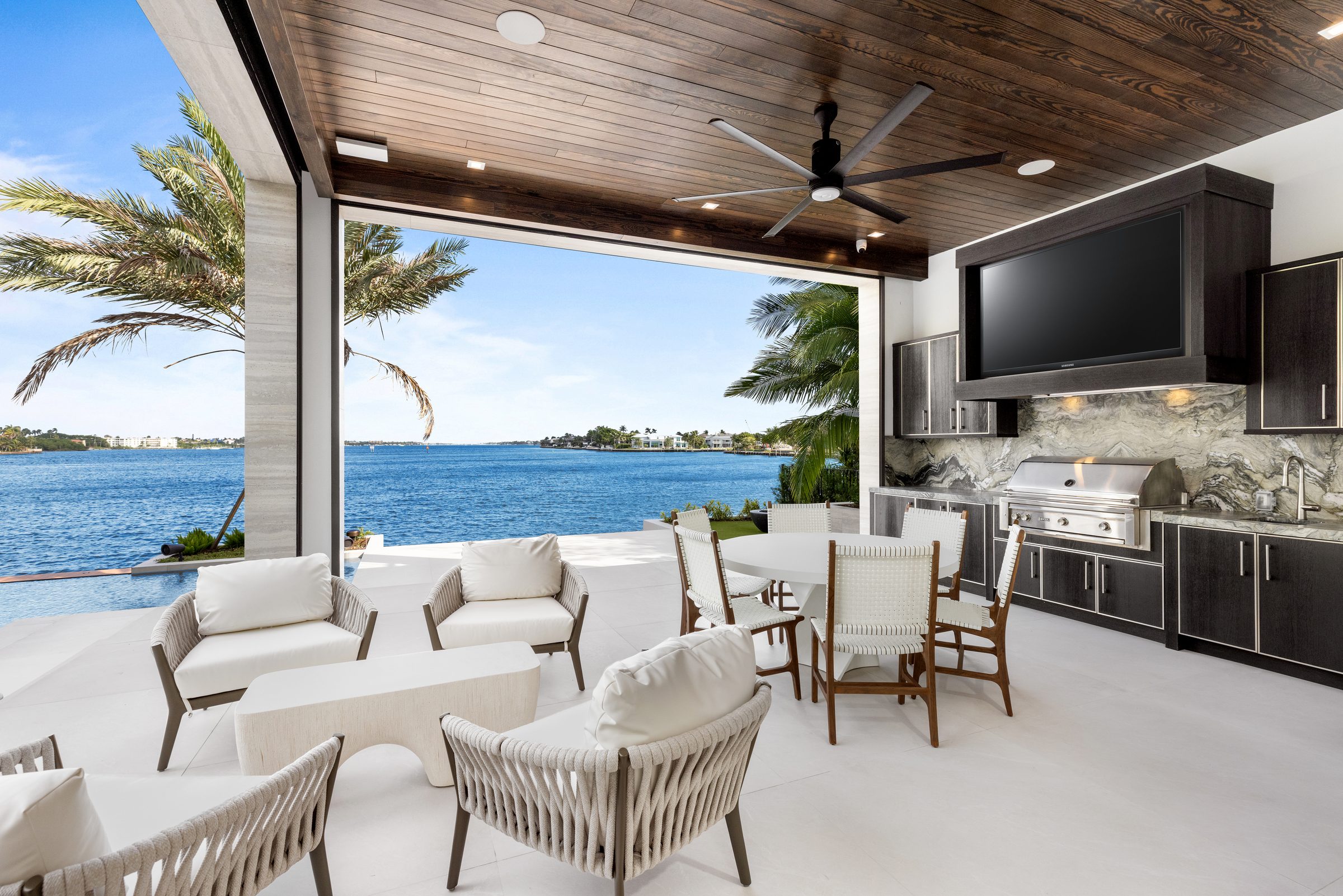 Covered loggia overlooking the water in Ocean Ridge — built by Varga Homes