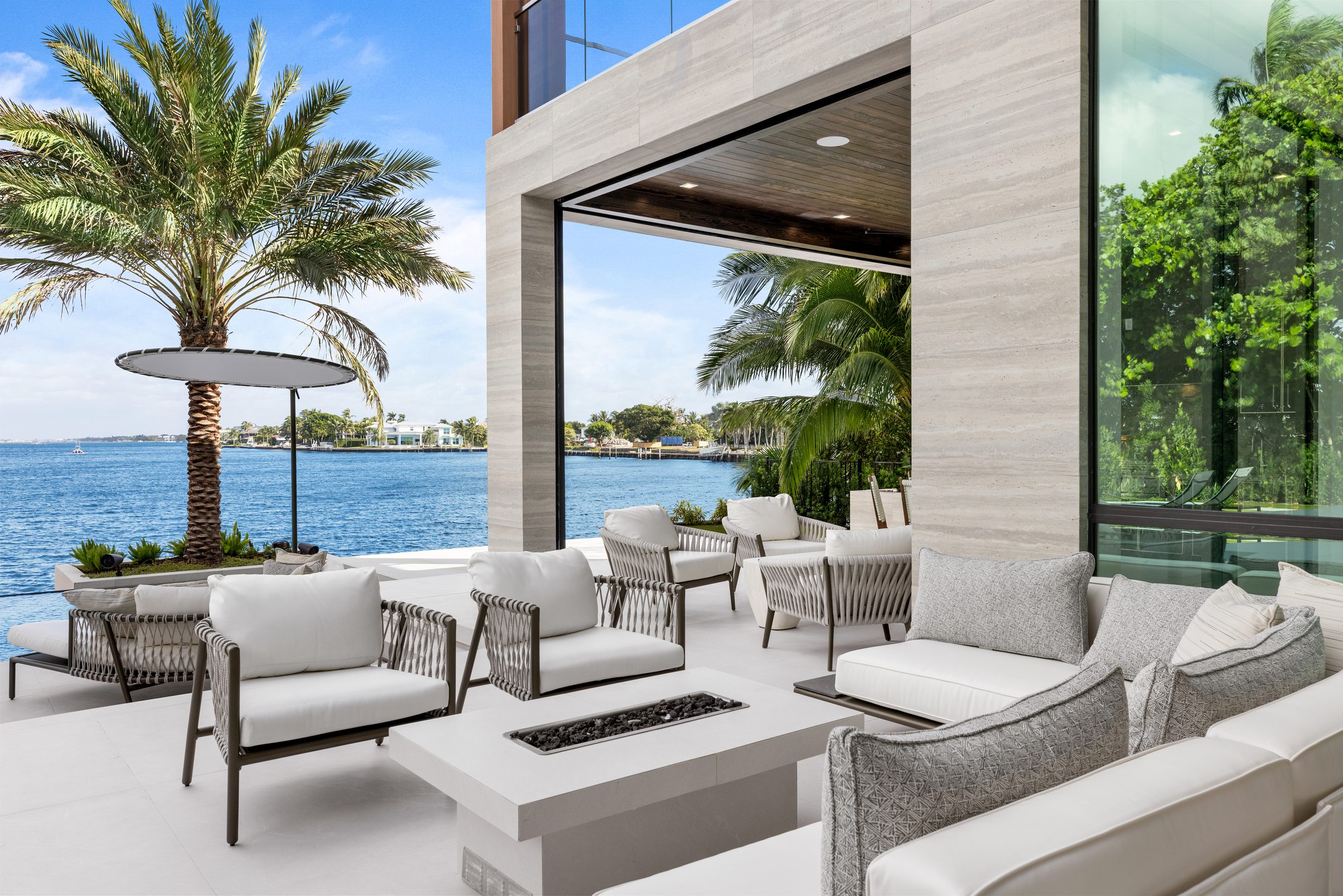 Covered loggia overlooking the water in Ocean Ridge — built by Varga Homes