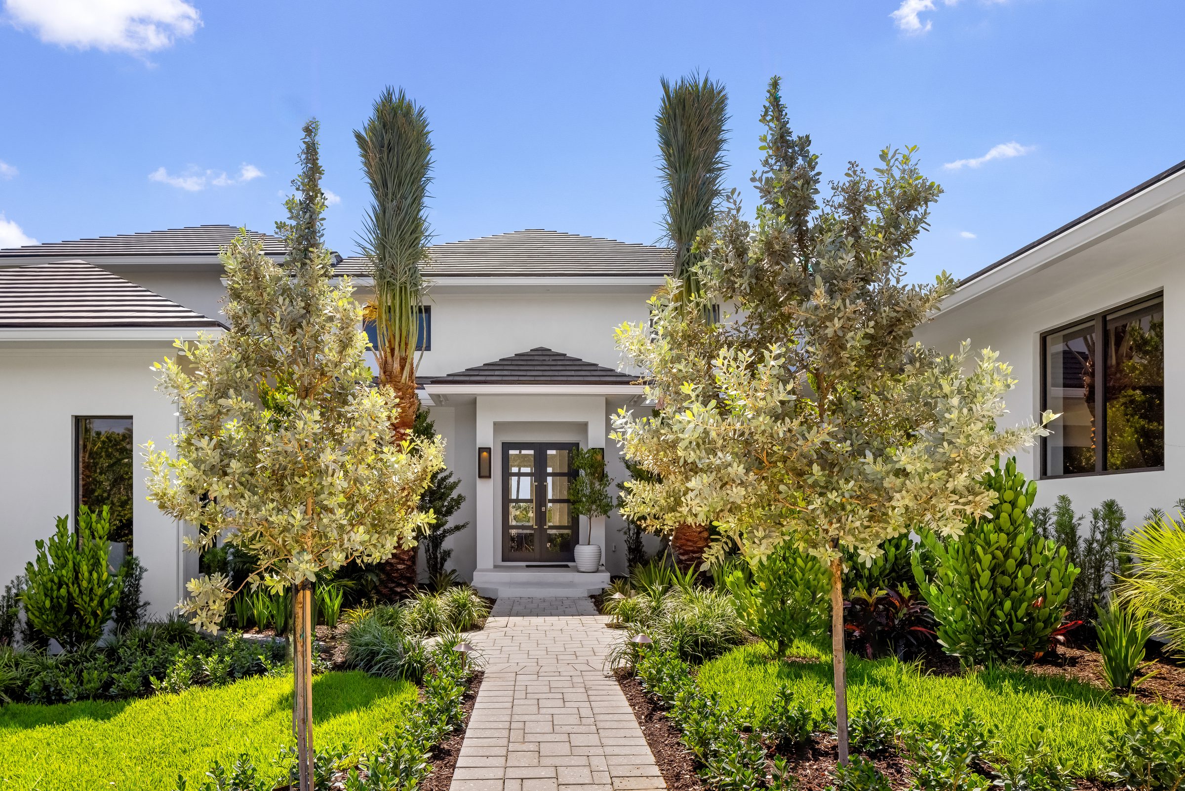 Front elevation of the custom home in Ocean Ridge — built by Varga Homes