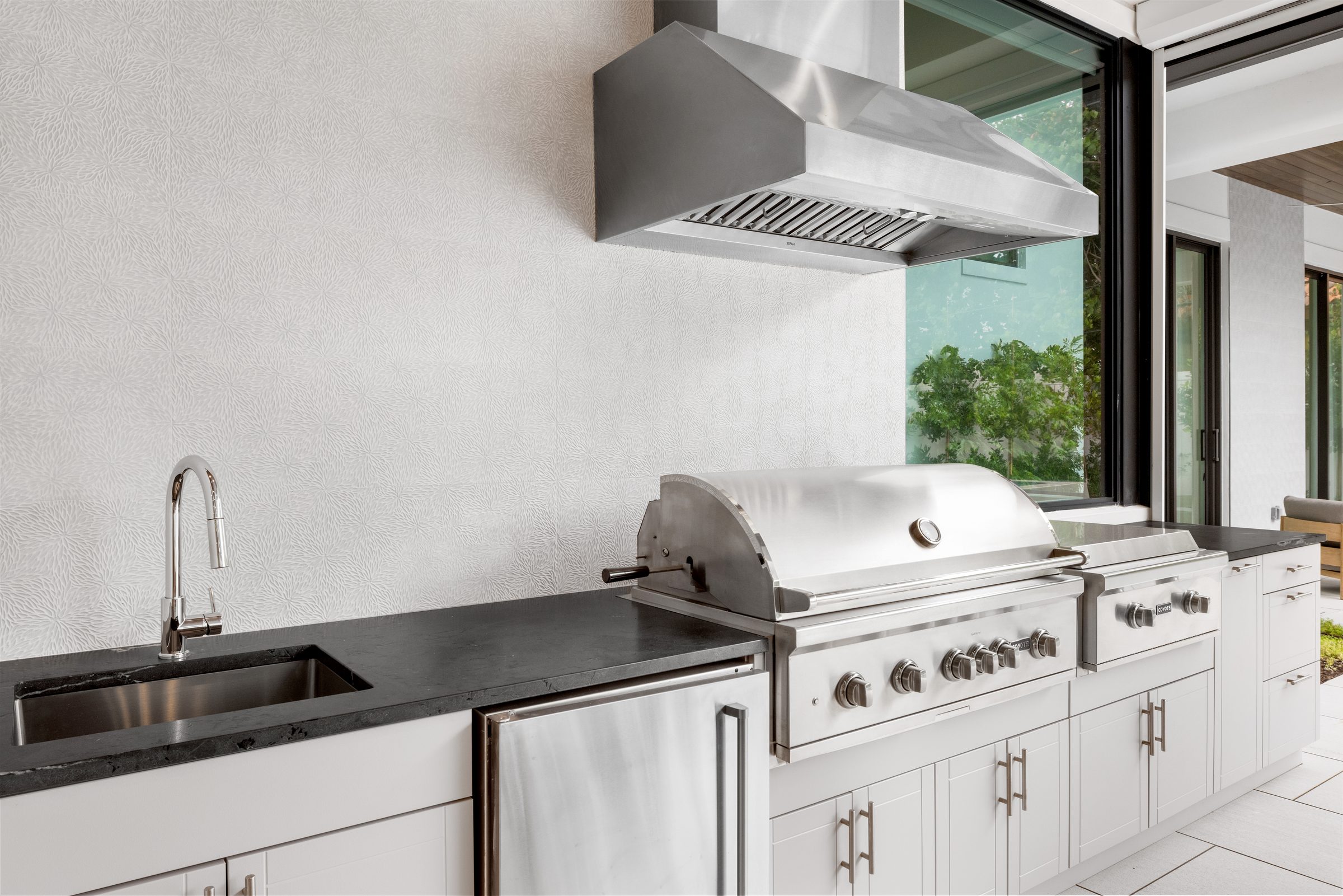 Outdoor kitchen and grill area in Delray Beach — built by Varga Homes