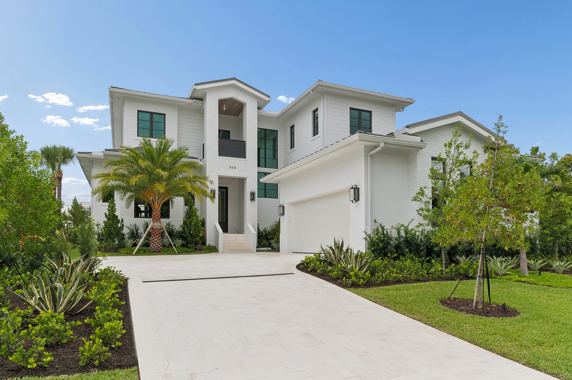 Front elevation of the waterfront custom home on Hypoluxo Island, Lantana — built by Varga Homes