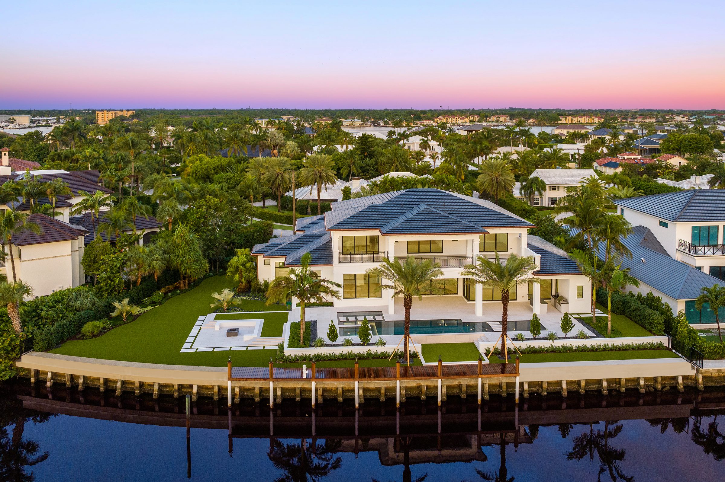 Sunrise aerial over the custom home in Manalapan — built by Varga Homes