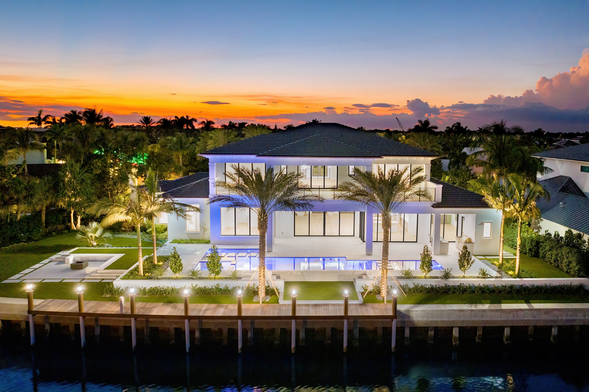 Sunset aerial over the custom home in Manalapan — built by Varga Homes